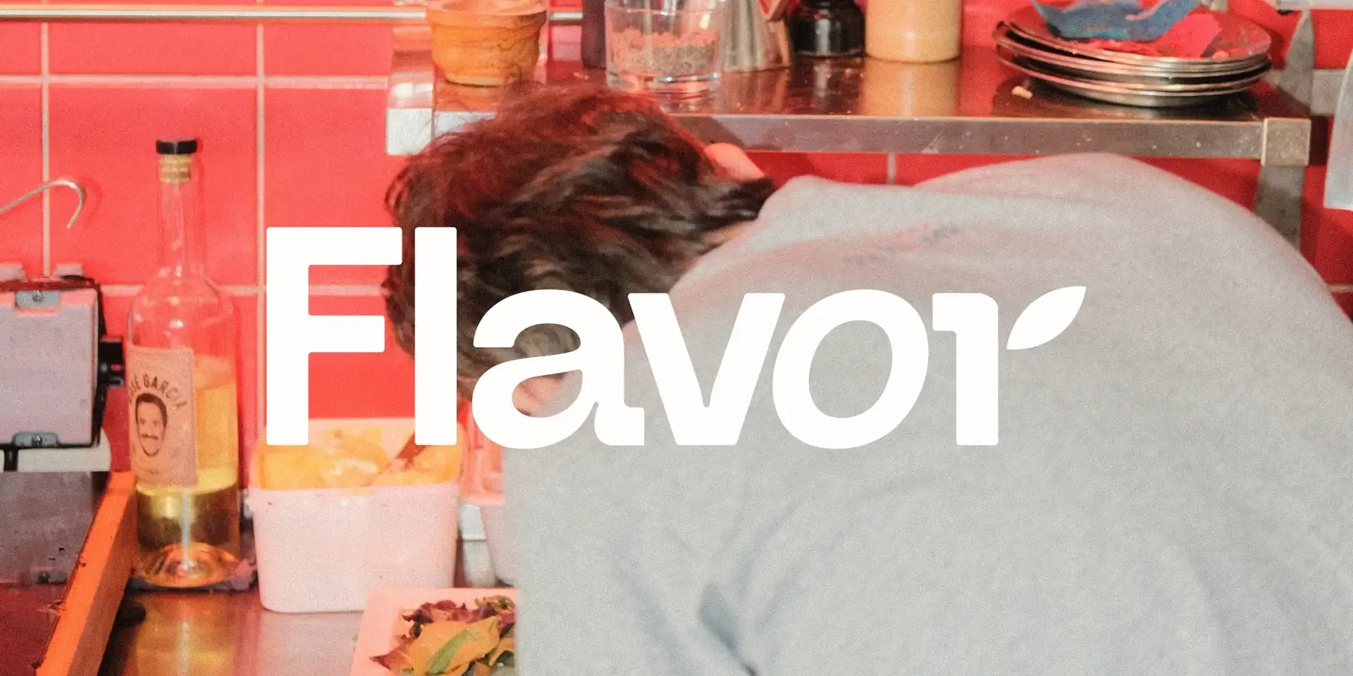 The Flavor logo over a kitchen