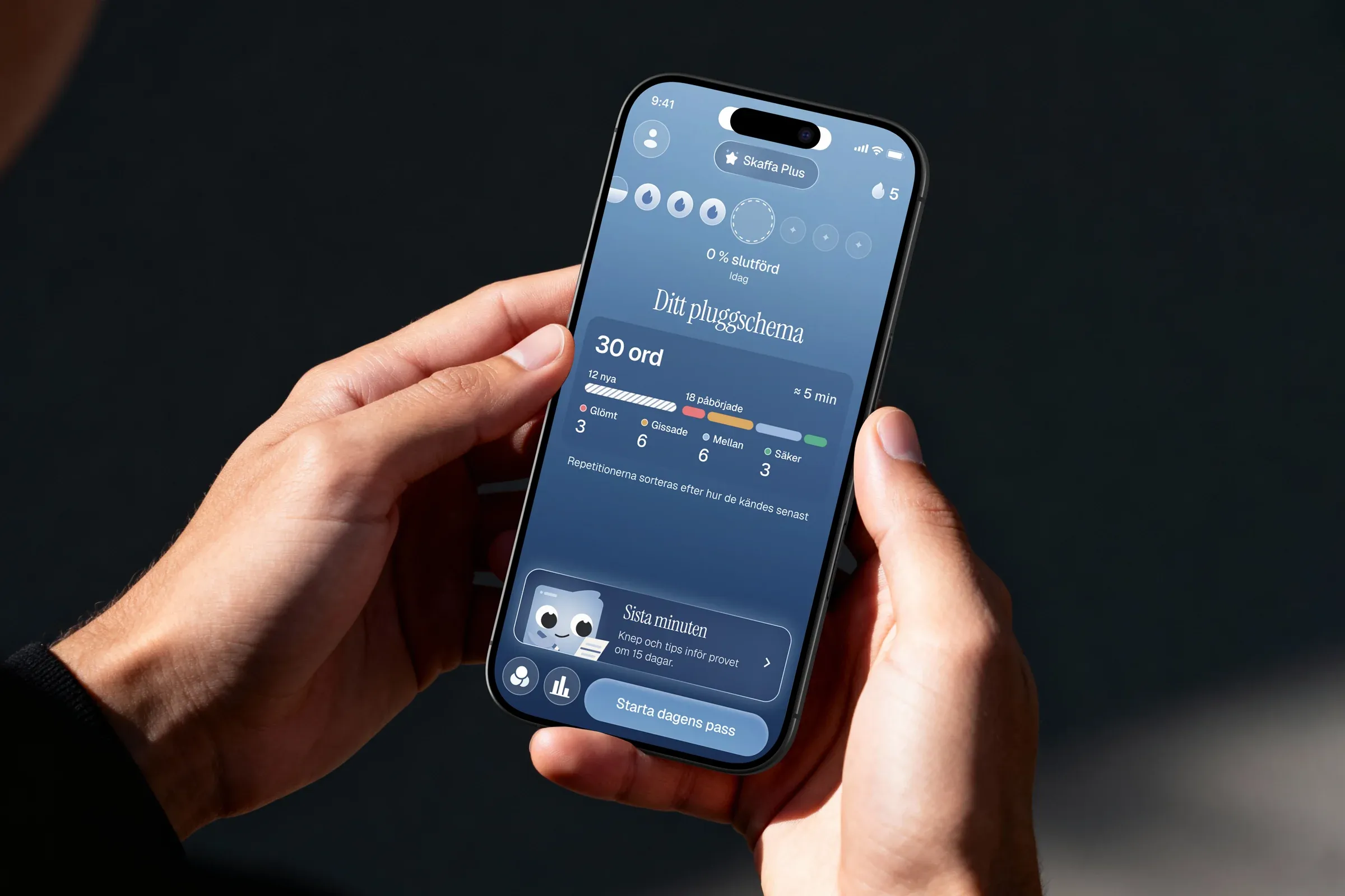 ETYMO's home screen on a phone held in two hands, on a dark ground
